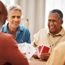 A group of senior men hanging out, playing cards