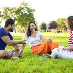 Three friends talking in the park